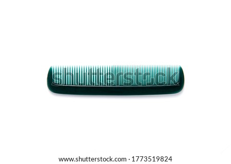 green colored hair comb isolated on total white background