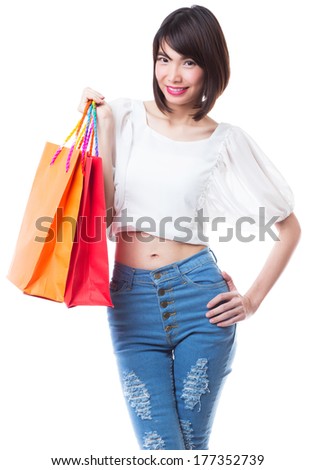 Happy shopping woman with shopping bags on white background