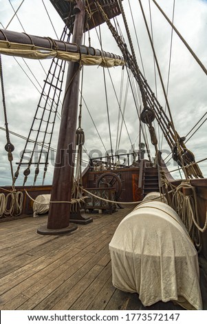 deck of a spanish galleon with mast and ropes