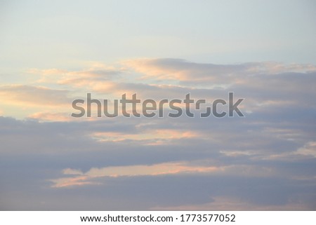 The clouds are lit by the evening sun