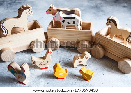 Children's wooden toys. Children wooden train with wagons. Natural wood construction set. Educational equipment. Noah's Ark