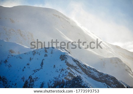 Beautiful view of Italian Alps with snow against a blue sky background