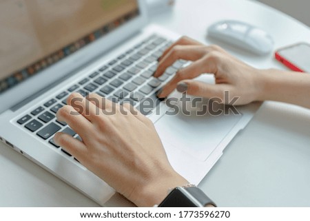 Woman hands typing on laptop keyboard at the office, Woman worker and business concept, Soft focus