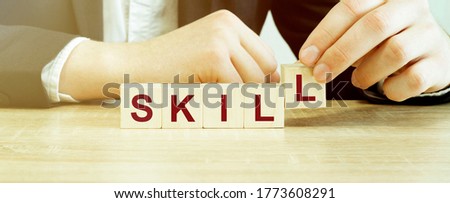 Word SKILL made with wood building blocks