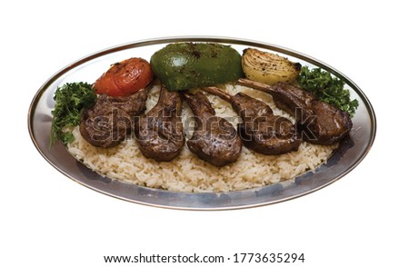 Lebanese style lamb chops over rice Royalty-Free Stock Photo #1773635294