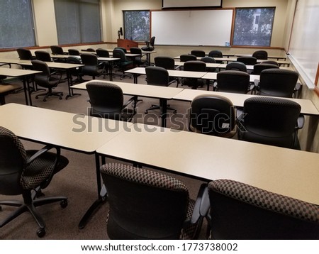 Classroom view from back right with white boards in front