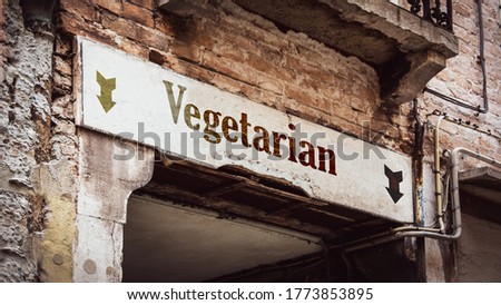 Street Sign the Direction Way to Vegetarian