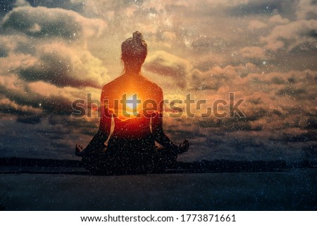 Yoga day concept. Multiple exposure image. Clouds and sun. Pranayama in lotus asana Royalty-Free Stock Photo #1773871661