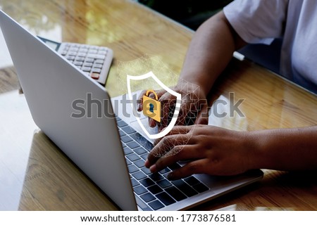 Laptop Computer with Data protection, Cyber security, information safety and encryption concept. internet technology and business concept, Mockup with copy space. Royalty-Free Stock Photo #1773876581