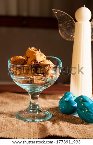 Chocolate Chip Cookies in a Bowl with Red Flowers and White Candle