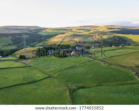 Aerial view of farmland near Ringstone Reservoir in the early morning, Calderdale, West Yorkshire