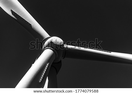 Wind farm wind mill turbine in black and white photography.
