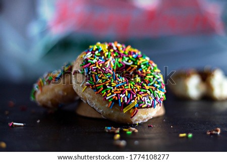 Group of glazed donuts on a black background,. - Image
