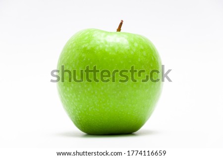 Fresh green apple on the white
