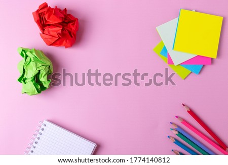 different stationary objects on mono color pink background. minimalism style, flat lay