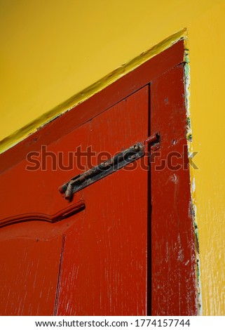 Vintage wooden door closed with a door lock