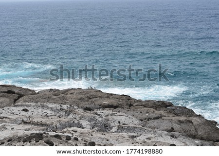 A photo of Atlantic ocean waves taken from volcanic Tenerifian coast at Tenerife, Canary islands. 