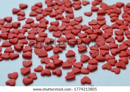 Many little red hearts, wallspaper, background, confectionery sprinkling.