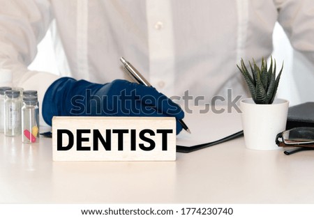 Dentist neon sign on brick wall background