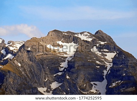 View of the snowy peaks and glaciers of the Swiss Alps from the Pilatus mountain range in the Emmental Alps, Alpnach - Canton of Obwalden, Switzerland