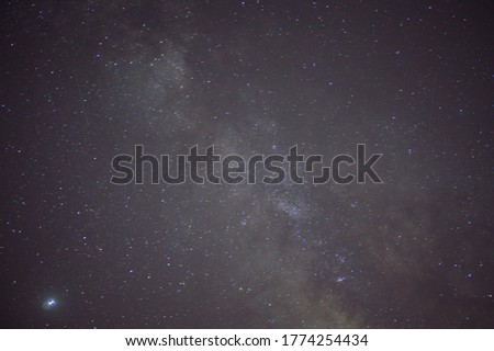 Astrological night sky with stars and constellations. The Milky Way and the accumulation of space debris in the galaxy.