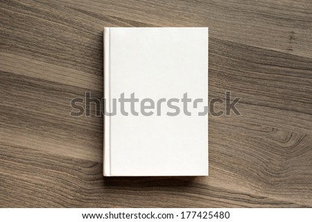 Photo blank book cover on textured wood background Royalty-Free Stock Photo #177425480