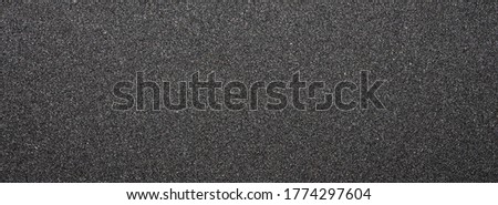 Black sandpaper.Texture of black sandpaper. Royalty-Free Stock Photo #1774297604