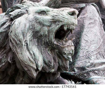 DSLR picture of a bronze sculpted head of a lion roaring, the symbol of Venice, Italy, in horizontal orientation