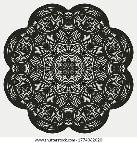 Beautiful and elegant monochromatic symmetrical mandala designs on solid sheet of wallpaper. Concept of home decor and interior designing.