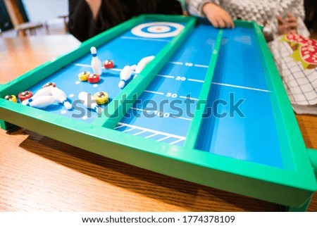 Stay at home with family image, playing classic table game with family.