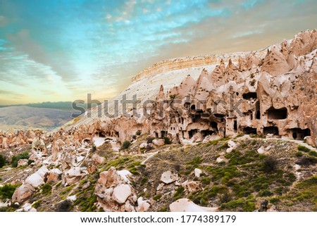Spectacular teeth-like rock formation and old christian caves in Zelve Valley in Cappadocia, Turkey Royalty-Free Stock Photo #1774389179