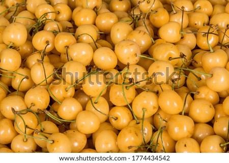 fresh white cherries for sale. top view