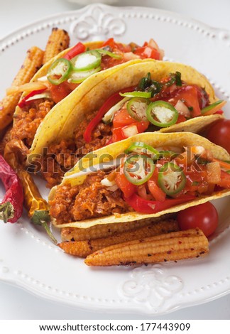 Mexican tacos with ground beef, chili salad and baby corn