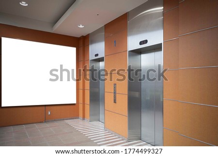 Blank billboards attached to the lift entrance hall