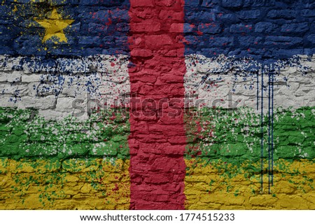 colorful painted big national flag of central african republic on a massive old brick wall