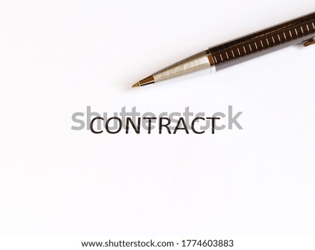 contract on the white paper with pen