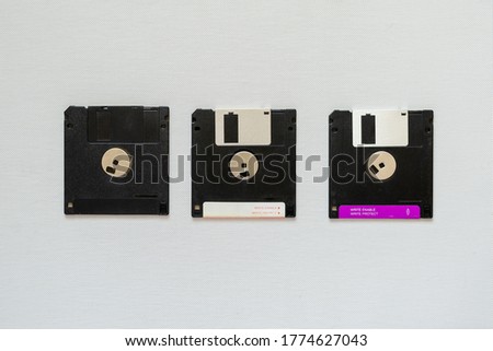 3.5 inch magnetic floppy disks. Three floppy disks on white backgrounde. Obsolete digital data storage media. Copy space