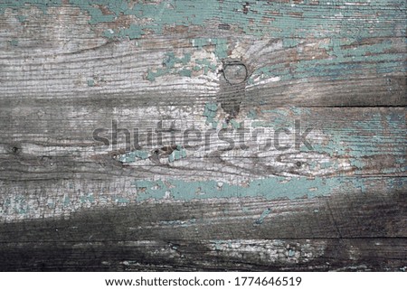 Gray old boards with peeling paint. Beautiful aged wood background