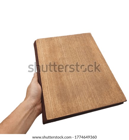 Male hand holding a book isolated on a white background.
Menu book