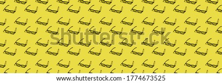pattern with 3d eyepiece on a yellow background, panoramic photo