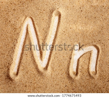 Letter N. English Handwritten Alphabet In The Sand