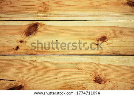 Treated lacquered pine boards in horizontal position with knots
