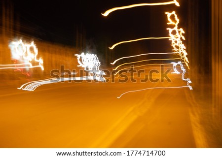 defocused street. Night traffic on the road and moving cars in the city. Blurred bokeh background