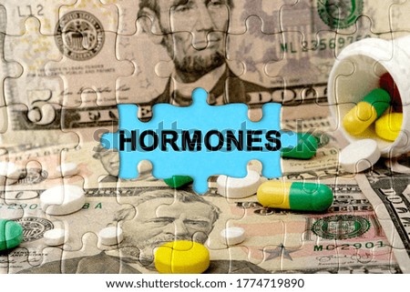 Double exposure. Puzzles depicting pills and dollars with the inscription -HORMONES. The concept of medicine.