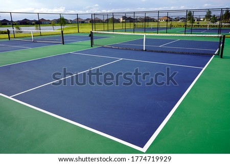 Multiple Pickleball Pickle ball Courts with blue sky background.                 Royalty-Free Stock Photo #1774719929