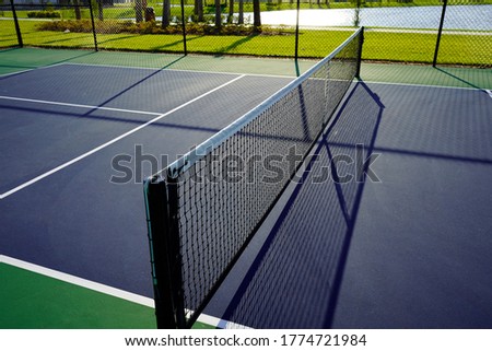Close up of a Pickleball Pickle ball Court and Net.                              Royalty-Free Stock Photo #1774721984