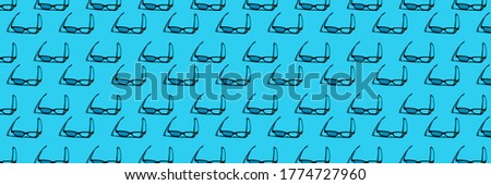 pattern with 3d eyepiece in which to watch a movie on a blue background. Panoramic photo 