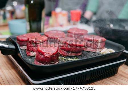 Raw beef meat for cooking steak. Raw beef is sliced, cooking meat for cooking steak in a cooking class. Steak minion.