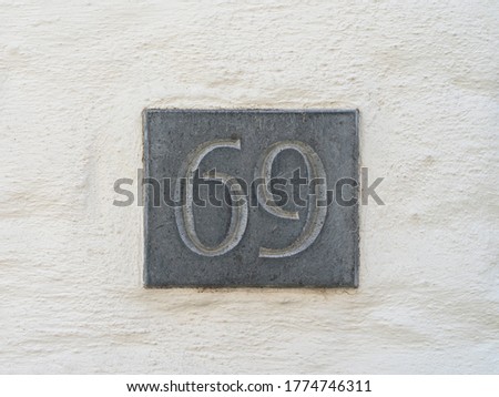close up of the blur number 69 in a wall house