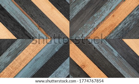 Shabby wooden wall with geometric pattern. Wood texture background.  Weathered parquet floor made of barn boards